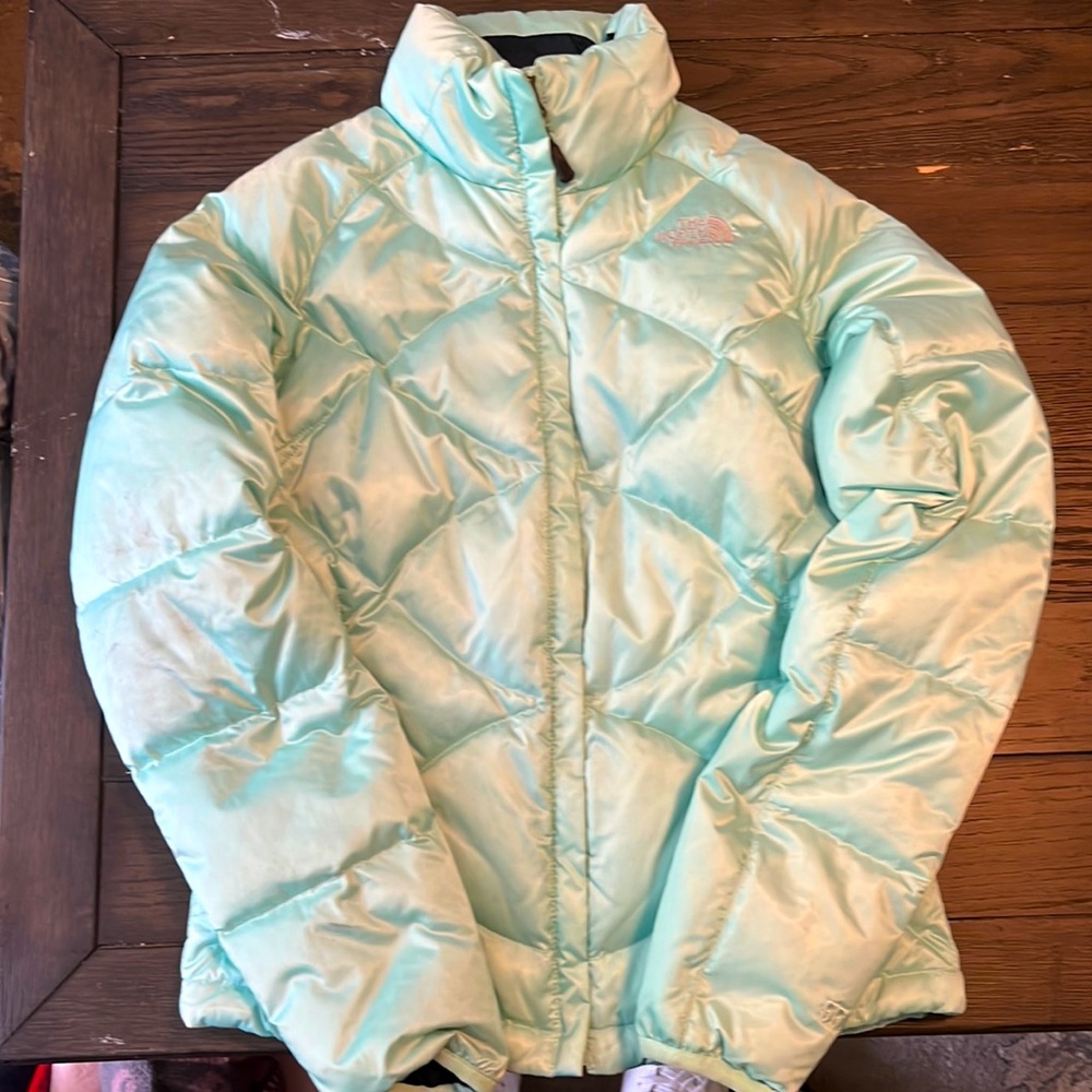 The North Face is women’s XS mint green puffer jacket